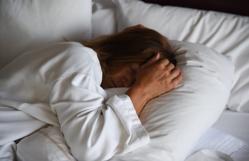 woman-in-bed-covering-head-in-morning-2024-10-17-06-37-00-utc